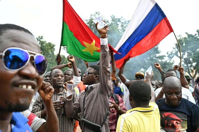Demonstrators lift Burkinabè and Russian flags after Burkina Faso’s second 2022 coup. Issouf Sanogo/AFP/Getty Images Demonstrators lift Burkinabè and Russian flags after Burkina Faso’s second 2022 coup. Issouf Sanogo/AFP/Getty Images