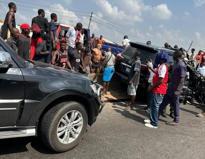 Anthony Joshua seated shirtless in his accident car