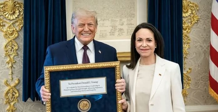 Donald Trump and María Corina Machado pose with the Nobel Peace Prize at the White House on Thursday, January 15, 2026