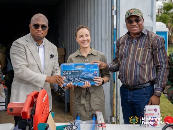 Samuel Okudzeto Ablakwa (left) making the donation to Kamina Abena Johnson Smith (middle)