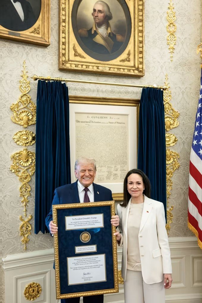 Donald Trump and María Corina Machado pose with the Nobel Peace Prize at the White House on Thursday, January 15, 2026