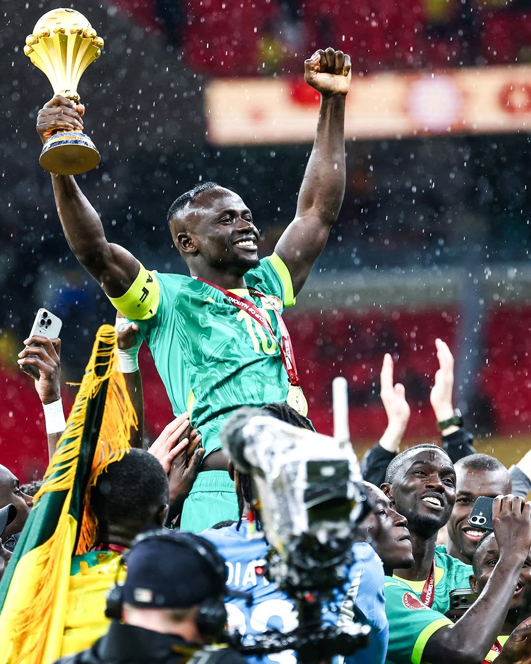 Sadio Mane, the best player of the tournament, lift the Afcon trophy with so much pride Sadio Mane, the best player of the tournament, lift the Afcon trophy with so much pride