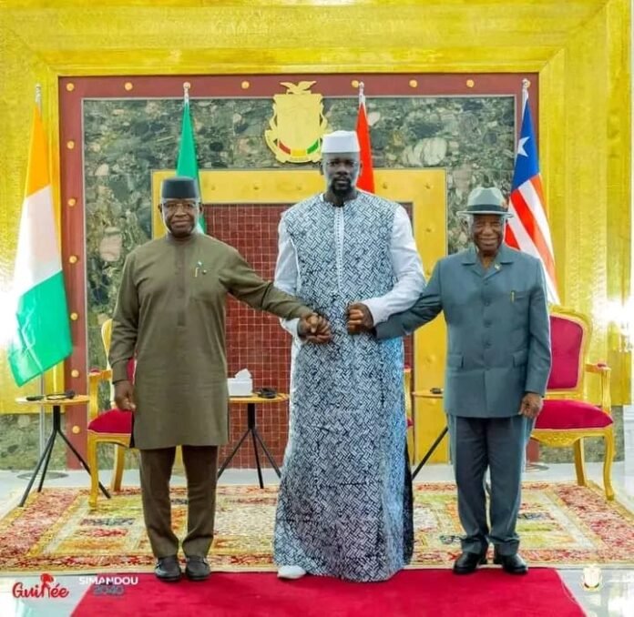 Julius Maada Bio (left), Mamadi Doumbouya (middle) a Joseph Nyuma Boakai (right) pictured after a recent peace talk in Guinea Conakry to address the border dispute