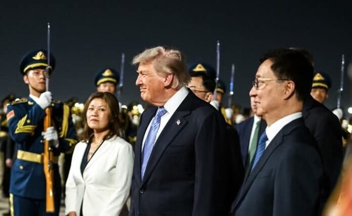 Donald Trump (middle) at the airport in Beijing upon his arrival Donald Trump (middle) at the airport in Beijing upon his arrival