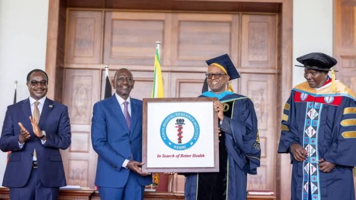 William Ruto (second left) awarding a charter