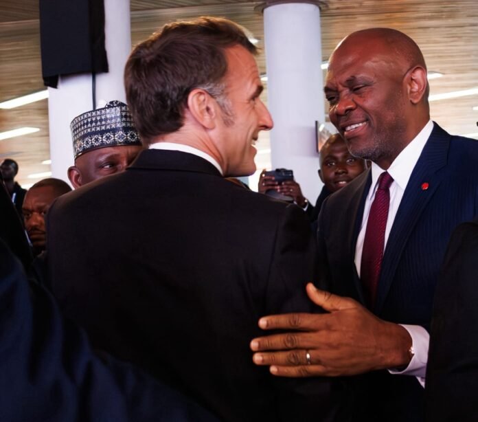 French President Emmanuel Macron (left) and Tony Elumelu (right)
