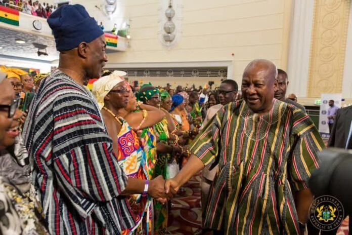 John Dramani Mahama (right) engaging with Ghanaians in London