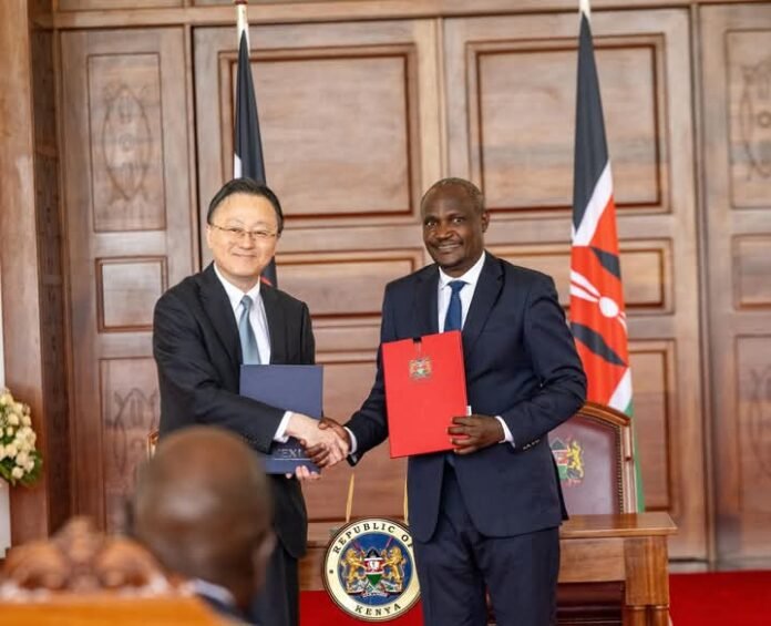 Chief Executive Officer of NEXI, Atsuo Kuroda (left) exchanging a copy of the agreement with his Kenyan counterpart Chief Executive Officer of NEXI, Atsuo Kuroda (left) exchanging a copy of the agreement with his Kenyan counterpart