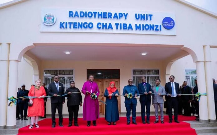 Samia Suluhu Hassan cutting tape on Wednesday, June 24, 2026 to mark the official opening of the Radiation Therapy Center
