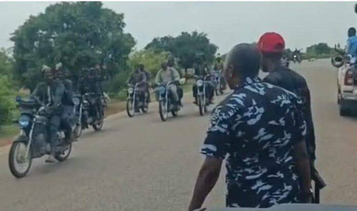 The men who were suspected to be bandits riding on motorcycles on a Katsina highway as an armed police officer looked on