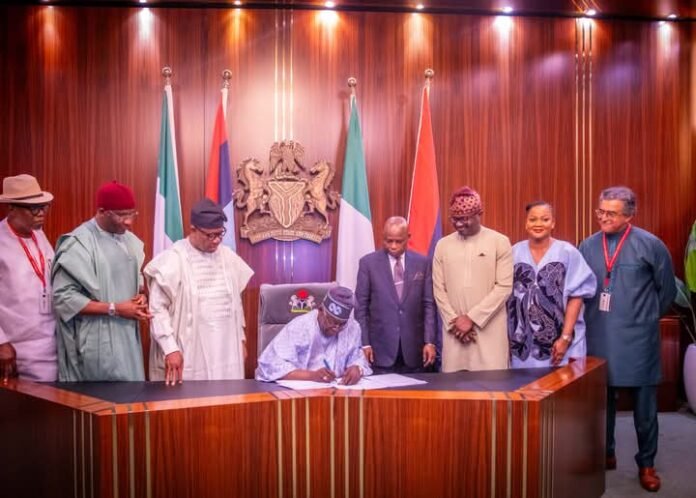 Bola Ahmed Tinubu signing the National Identity Management Commission (NIMC) Act 2026 into law on Friday, June 26, 2026