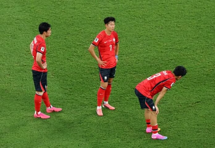 South Korea players looking dejected after their poor performance at the World Cup
