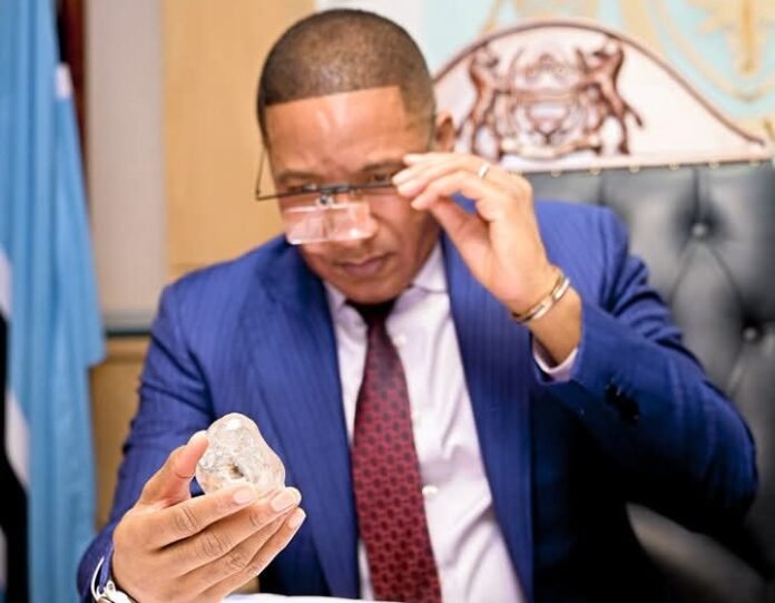 Duma Gideon Boko holding the 1,300-carat diamond recovered by Lucara Botswana