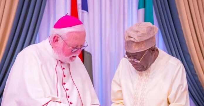 Paul R. Gallagher (left) and Bola Ahmed Tinubu in Abuja 