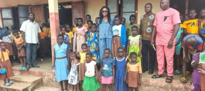 Dr Mrs Vera Beyuo with some beneficiaries of her charitable initiative Dr Mrs Vera Beyuo with some beneficiaries of her charitable initiative