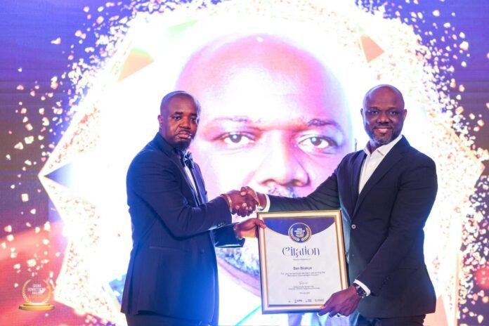 Mr Godwin Kudzo Tameklo (left) receiving his award Mr Godwin Kudzo Tameklo (left) receiving his award
