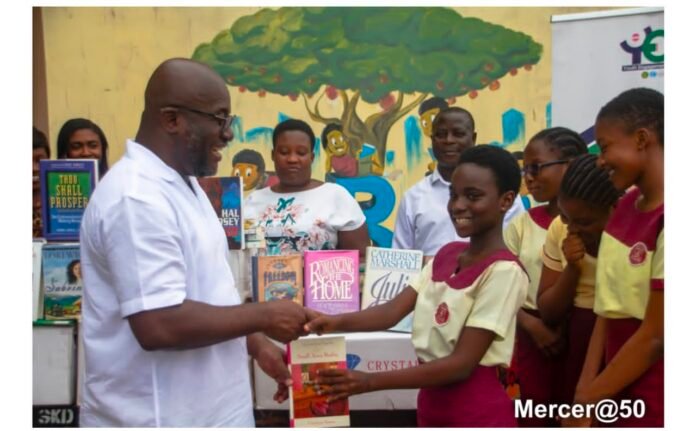 Andrew Egyapa Mercer presenting learning materials to pupils in the Sekondi Electoral Area Andrew Egyapa Mercer presenting learning materials to pupils in the Sekondi Electoral Area